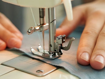 Sew clothing by hand, using a needle and thread or with sewing machines