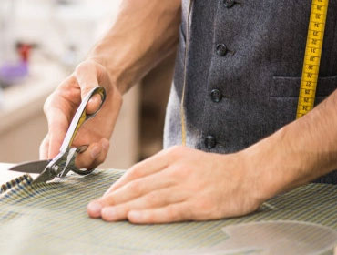 Cut and measure fabric according to a pattern or design
